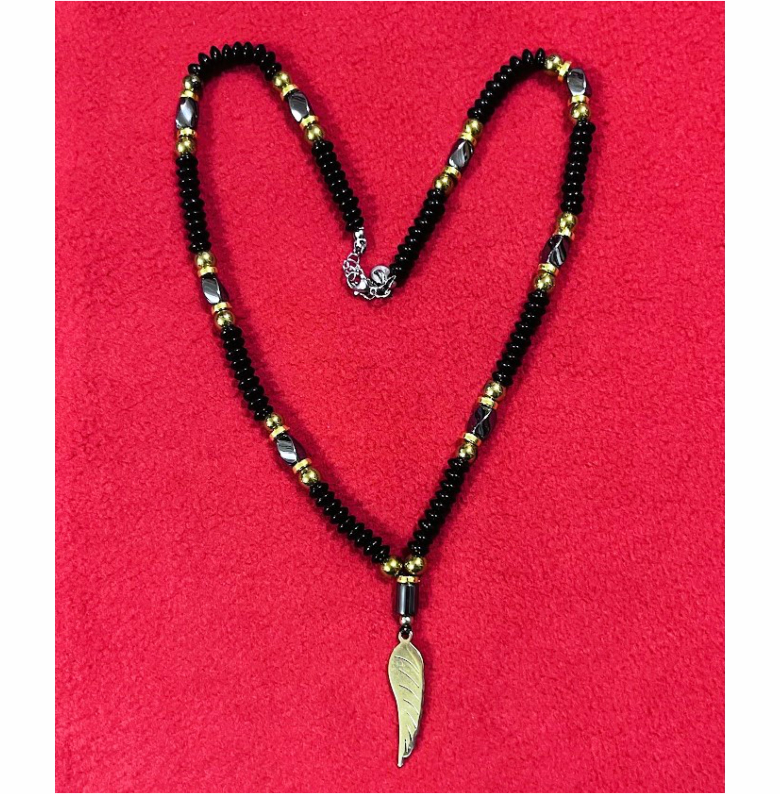 Handcrafted Black Beaded Necklace with Gold Accents and Feather Pendant for Men