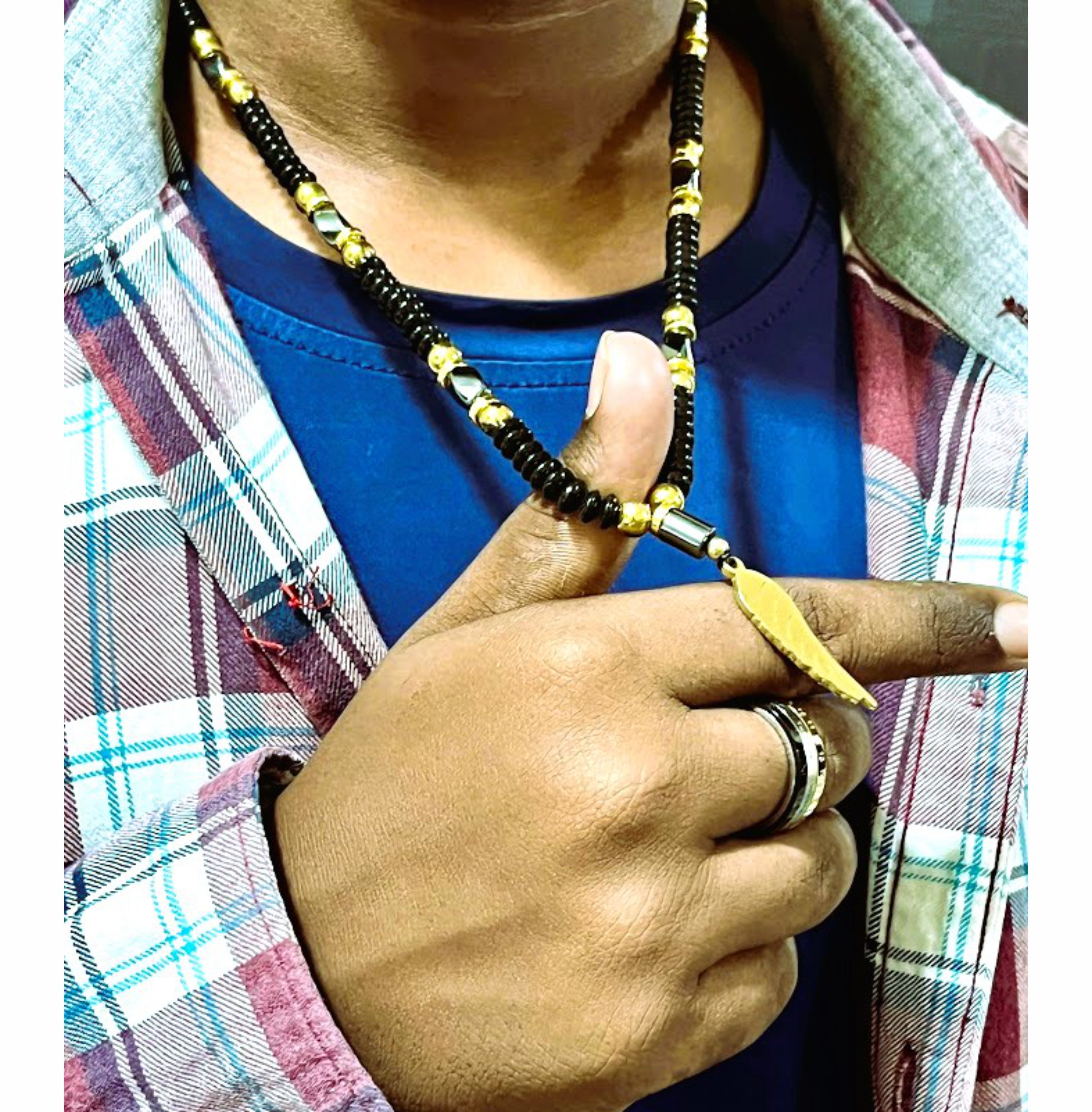 Handcrafted Black Beaded Necklace with Gold Accents and Feather Pendant for Men